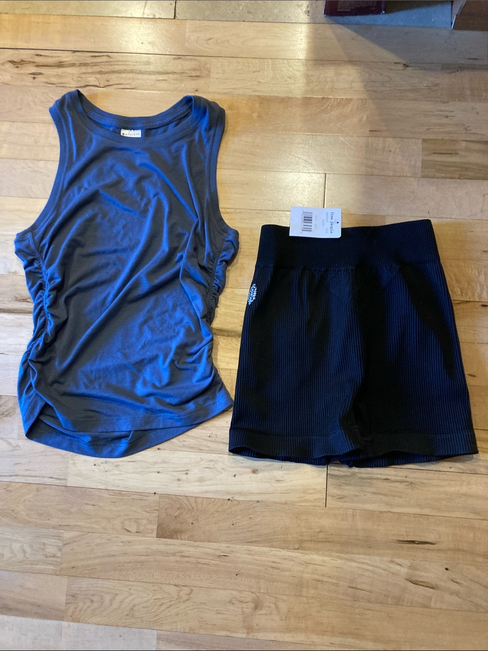 Bundle of Athleta with ease cinch tank xs and NWT happiness runs shorts xe